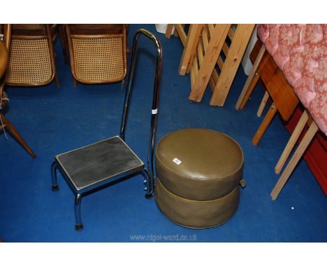 A faux leather pouffe and a step stool with hand rail.
