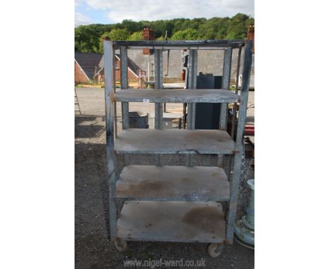 Four shelf galvanized metal trolley, 38'' x 26'' x 64''.