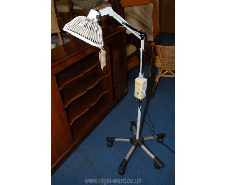A floor standing heat lamp, new element required.