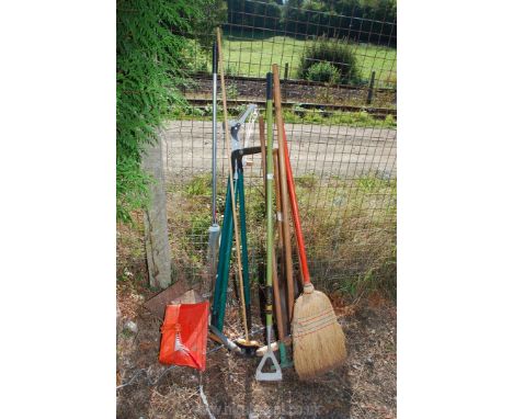 A quantity of garden tools including brooms, shovel, branch lopper, lawn shears, rake etc.