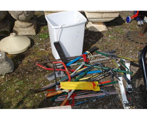 Bin of garden shears, saws, hand tools etc.
