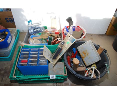 Two buckets and a tray of miscellaneous hand tools including staple guns, carving set, worktop storage boxes etc.