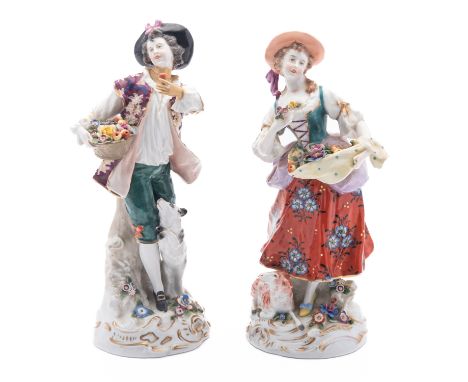 A pair of Samson Paris porcelain figure groups of a Shepherd and Shepherdess gathering fruit and flowers, on gilt scroll base