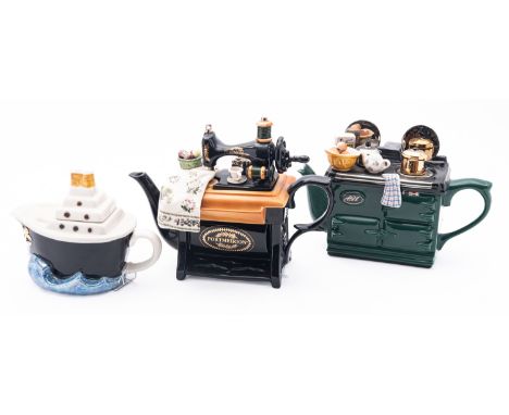 Three novelty tea pots, comprising a Teapottery AGA example modelled with a surface crowded with kitchenalia, a Cardew Design