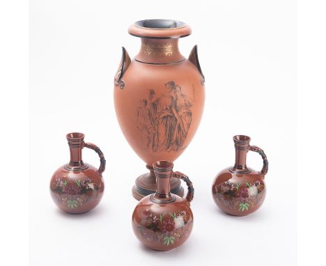 A Watcombe pedestal vase, modelled after a classical Greek form with Anthemion handles and printed in black with the Three Gr