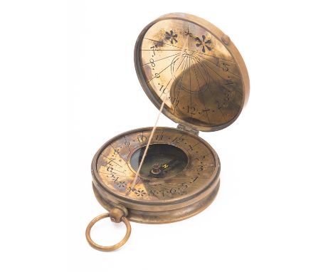 A reproduction brass 'Maritime Pocket Sundial' in wooden case