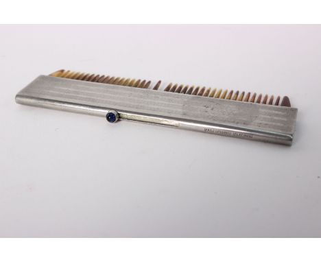 A Platinon retractable moustache comb. Faux tortoise shell comb with engine turned case and blue glass cabochon button. 