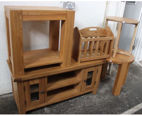 A group of light oak furniture, to include a TV/entertainment unit (h: 55cm w: 115cm d: 45cm), with a rectangular occasional 