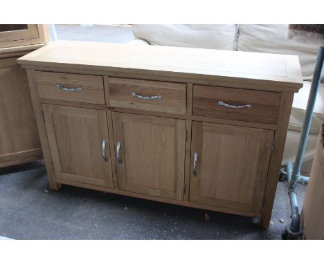  A light oak corner cabinet (h: 181cm  w: 41cm  d: 41cm ), together with a sideboard (h: 80cm  w: 131cm  d: 38cm) 