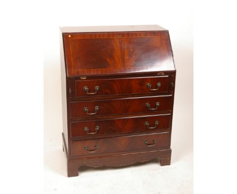 A George III style mahogany bureau with four graduated drawers on bracket feet 99cm high, 75cm wide and a vintage Roberts rad