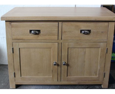 A light oak small sideboard (h: 90cm  w: 110cm  d: 45cm) and tall light oak bookcase (h: 180cm  w: 75cm  d: 30) 