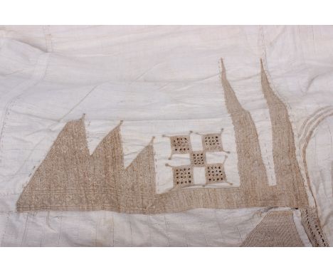 An early 20th Century cream heavy cotton man's robe from the East Coast of Africa, decorated with light brown appliqué and em