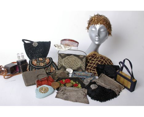 Three early 20th Century mesh evening bags, two glass perfume bottles within a leather case, an early 20th Century coin case,