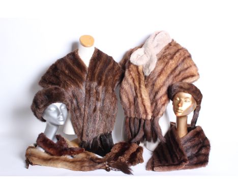 Two 1950s fur stoles; a mink headband, an F K Bauers fur wrap with tails,  a musquash fur stole, a St Bernhard scarf,  two pa