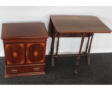 An Edwardian mahogany inlaid sutherland table with bobbin-turned legs, together with a small mahogany and inlaid table cupboa