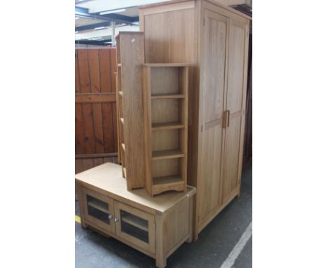 A light oak double wardrobe (h: 190cm w: 105cm d: 59cm), light oak entertainment unit (h: 50cm w: 100cm d: 45cm) and a set of