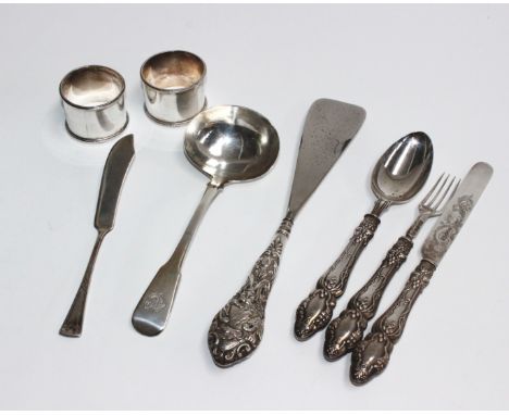 A mixed collection of sterling silver items to include three Victorian desert forks, a small butter knife, a silver handled s