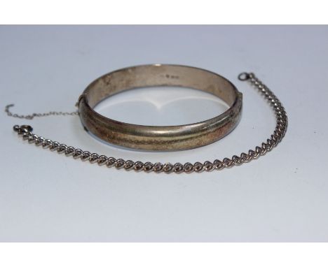 A Chinese mother of pearl panel bracelet in unmarked white metal together with a boxed sterling silver bangle.