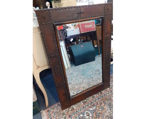 A 20th century leather and studwork wall mirror A/F 64cm x 93cm Location: RAM 