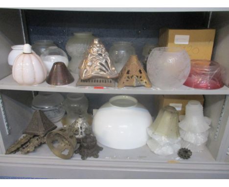 A selection of Victorian oil lamp part and glass shades to include a cascade pattern shade of clear glass turning of a pink c