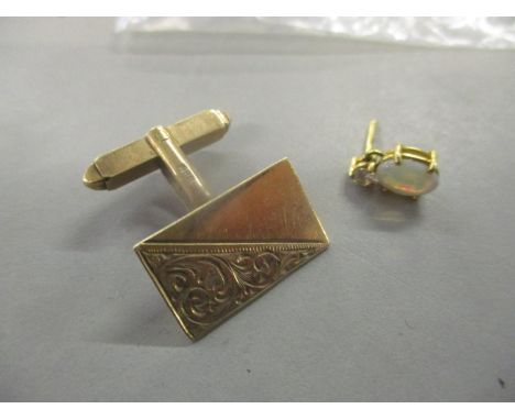 A 9ct gold cufflink, 2.9g, together with an 18ct gold opal drop and diamond earring, 0.7gLocation: 