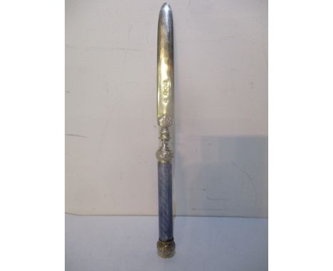 An early 20th century silver paper knife with a purple guilloche enamel handle, hallmarked London 1904 