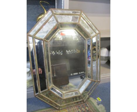 A modern Venetian style wall mirror of octagonal form with bevelled glass plate 83cm x 60cm 