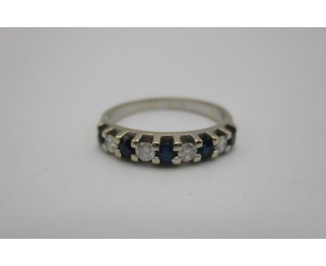 An 18ct white gold, diamond and sapphire half-eternity ring, set with five sapphires and four diamonds, size K, 2.3g Location