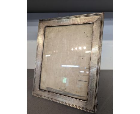 An early 20th century silver fronted engine turned photograph frame 