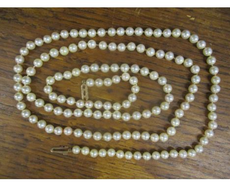 A pearl necklace with 9ct gold clasp having engraved decoration, 96cm longLocation: 