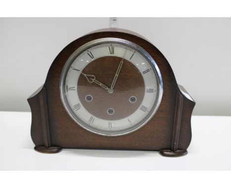 A vintage wooden mantle clock 