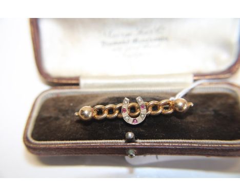 An Edwardian 9ct gold ruby &amp; seed pearls bar brooch in a fitted case 