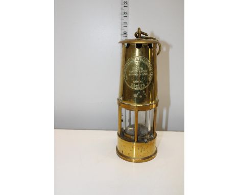 A vintage brass miners lamp 
