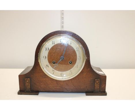 A antique wooden cased mantle clock 