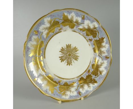 A NANTGARW PORCELAIN PLATE of lobed form decorated with a continuous vine of gilded leaves on light blue ground to the border