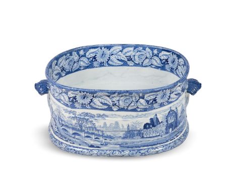 A STAFFORDSHIRE POTTERY BLUE AND WHITE PRINTED FOOTBATH  CIRCA 1820  Decorated with a topographical print of a bridge in a la