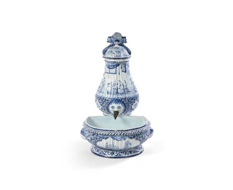 A DUTCH DELFT CISTERN, COVER AND BASIN 19TH CENTURY Of gadrooned form and decorated in the late 17th century De Grieksche A F