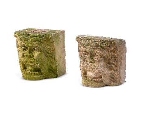 TWO SIMILAR COMPOSITION STONE ARCHITECTURAL ELEMENTS  20TH CENTURY  Possibly corbels or keystones, each modelled with mouth a