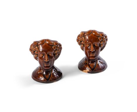 A PAIR OF STAFFORDSHIRE TREACLE-GLAZED SASH WINDOW STOPS  MID 19TH CENTURY   Modelled as busts, circa 12.5cm high  