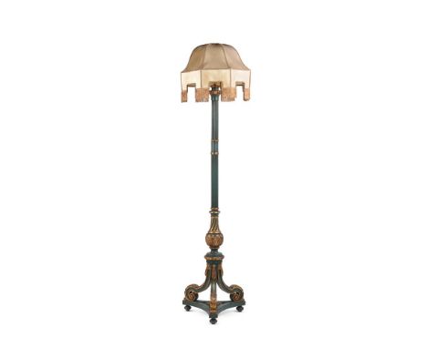 A GREEN PAINTED AND PARCEL GILT STANDARD LAMP  IN THE REGENCY MANNER, EARLY 20TH CENTURY  193cm high overall including shade 