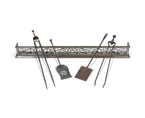 A PIERCED AND POLISHED STEEL FENDER  POSSIBLY IRISH, 19TH CENTURY  13cm high, 126cm wide, 13cm deep        Together with four