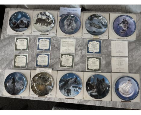 Ten Boxed Bradford Exchange - The Realm of the Wolf Collection Decorative Collectable Plates. 
Good condition, no damage. 