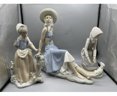 Large NAO by Lladro - Girl with a Sun Hat Sitting on the Rocks (small chip to the finger), NAO by Lladro - Girl with Butterfl