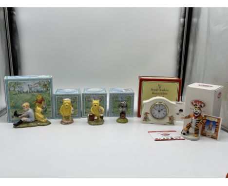 Four Boxed Royal Doulton Winnie The Pooh Figurines along with Royal Doulton Bunnykins Clock and Wade Tony The Tiger. 
Good co