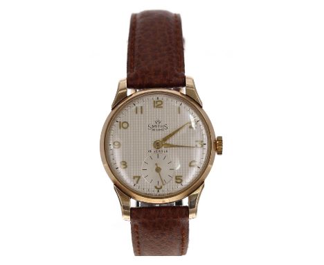 Smiths De Luxe 9ct gentleman's wristwatch, Edinburgh 1954, circular silvered 'hobnail' dial with applied gilt Arabic numerals
