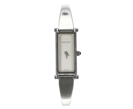 Gucci stainless steel lady's bangle wristwatch, reference no.1500L, serial no. 074xxxx, silvered dial, quartz, 12mm-Box and P