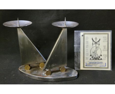 20th CENTURY DOUBLE CANDLESTICK HOLDER BY ROBIN ANGELO FARETTI,stamped R.A.F Ni4/98, serial number A0010, in steel and brass,