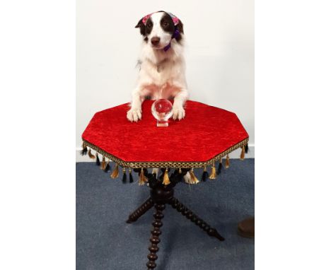 VICTORIAN GYPSY STYLE OCCASION TABLE the octagonal top upholstered in red velvet with black and gold tassels hanging from the