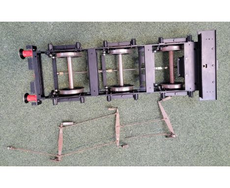 FIVE INCH GAUGE MODEL ENGINE CHASSIS painted in red and black with wheels, 65cm long
