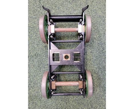 FIVE INCH GAUGE MODEL ENGINE CHASSIS painted in black and green with wheels, 28cm long